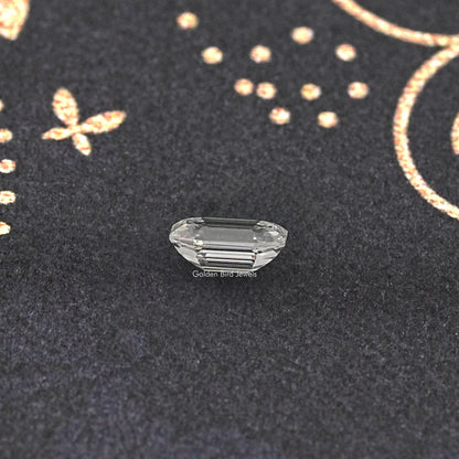 Emerald-cut lab-grown diamond with step facets, face-up close view