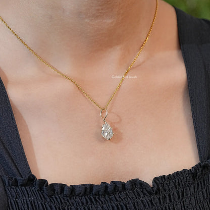 Gold-tone pear-cut pendant showing teardrop moissanite stone in bezel setting