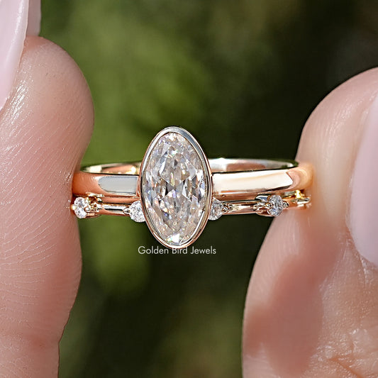Gold-toned oval moissanite solitaire ring set with slim side-stone bands
