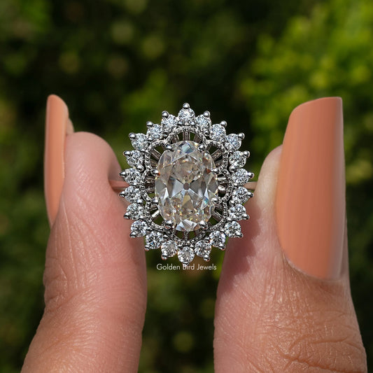 Oval moissanite halo ring with large center stone and sparkling halo, front close-up