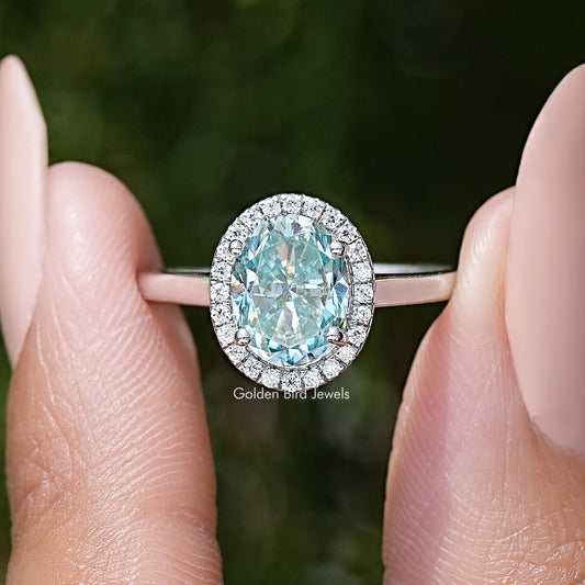Sterling silver oval moissanite halo ring with bright round halo accents