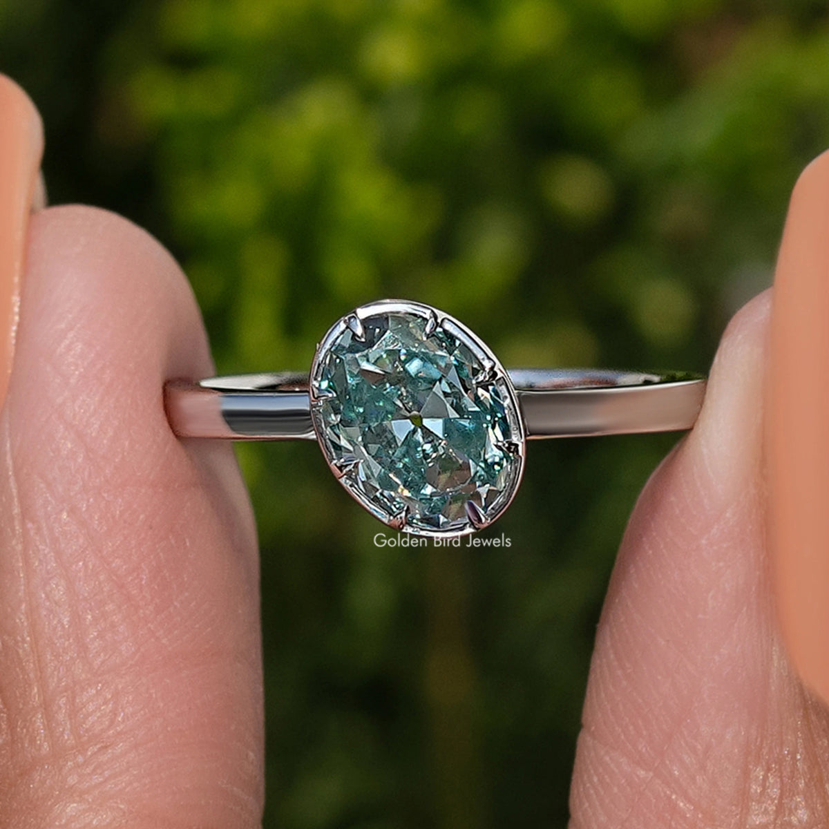 Oval blue moissanite solitaire ring in 925 sterling silver, front gemstone view