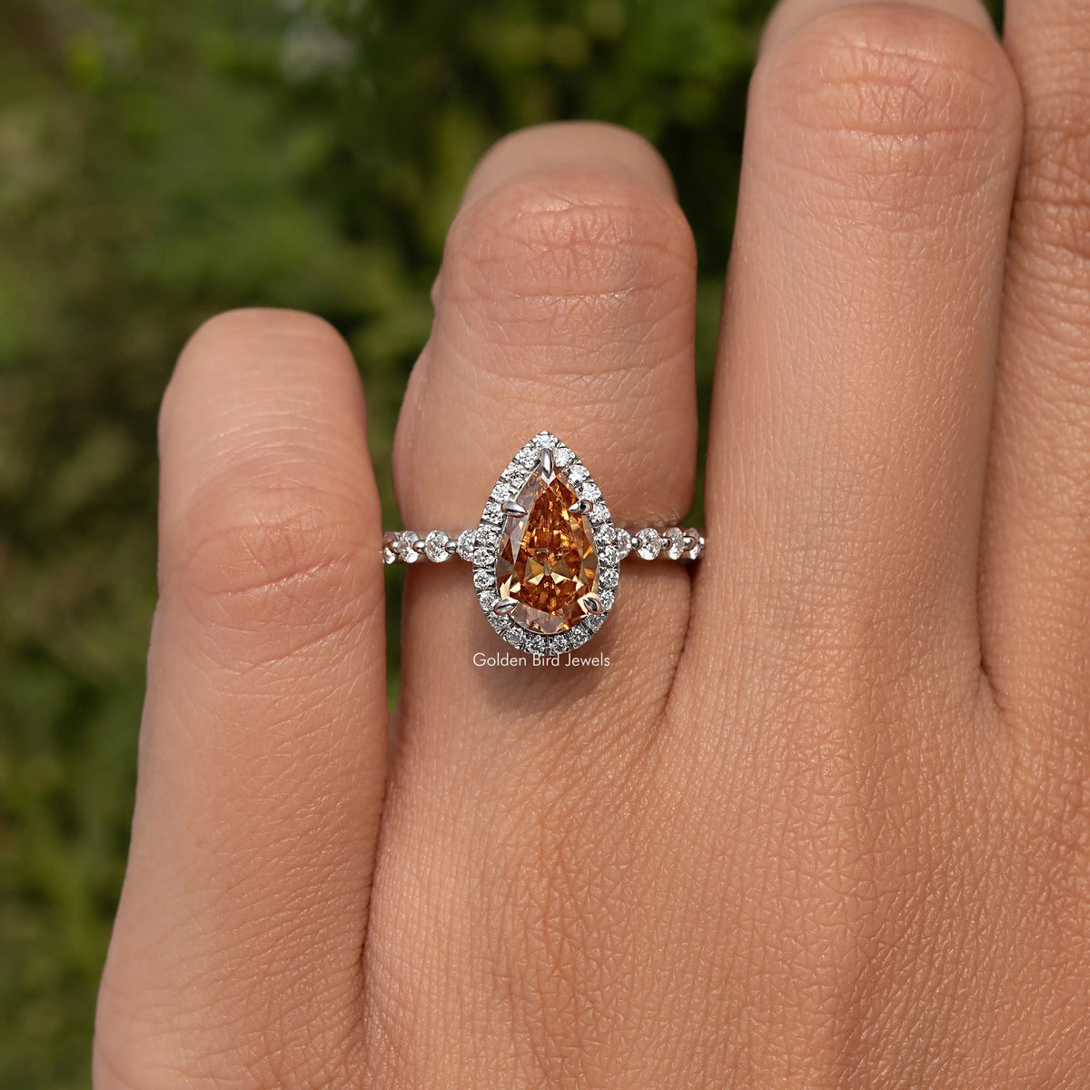 925 sterling silver pear-cut halo ring with marquise side stones and warm orange center