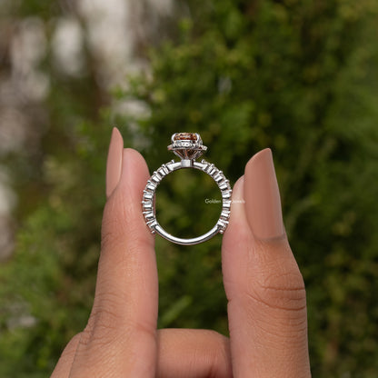 925 sterling silver halo ring with pear-cut center; split shank with small clear stones