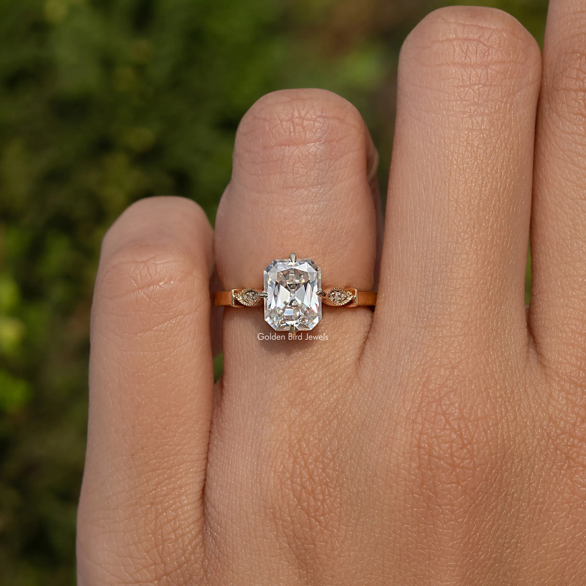 Sterling silver moissanite engagement ring with radiant center and small side stones