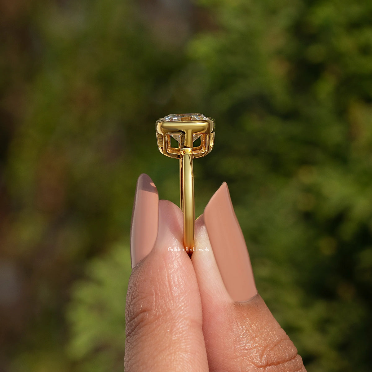 Gold bezel-set moissanite solitaire ring with square cushion stone