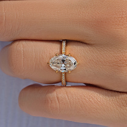 Oval-cut moissanite ring with pavé-accented band