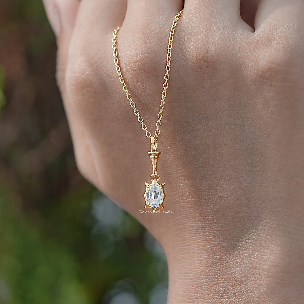 In hand Showing View Of Old Mine Cushion Moissanite Pendant 