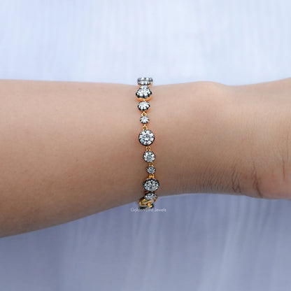 Round diamond-like tennis bracelet with silver prong setting, wrist close-up