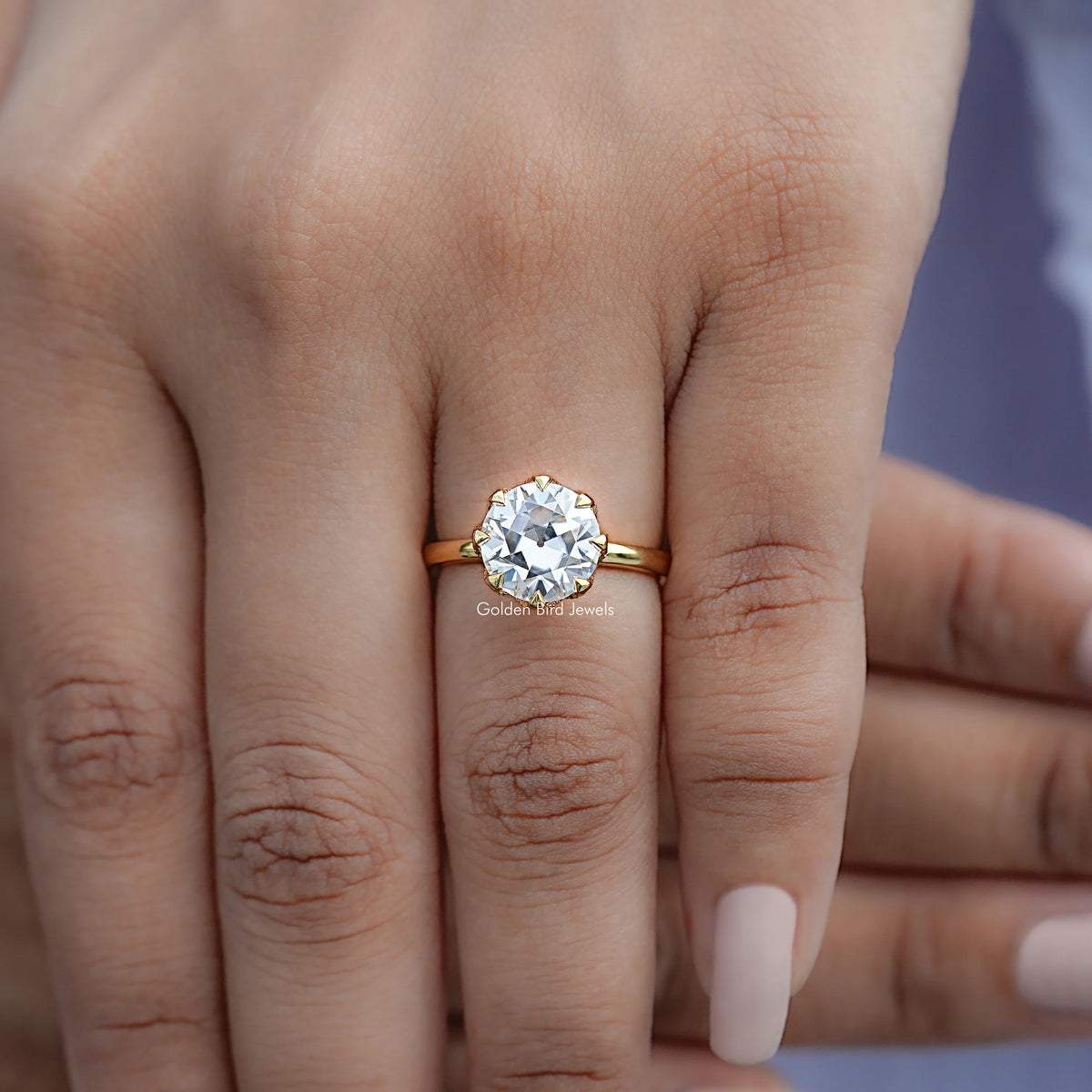 View of Round Cut Solitaire Engagement Ring in prongs setting