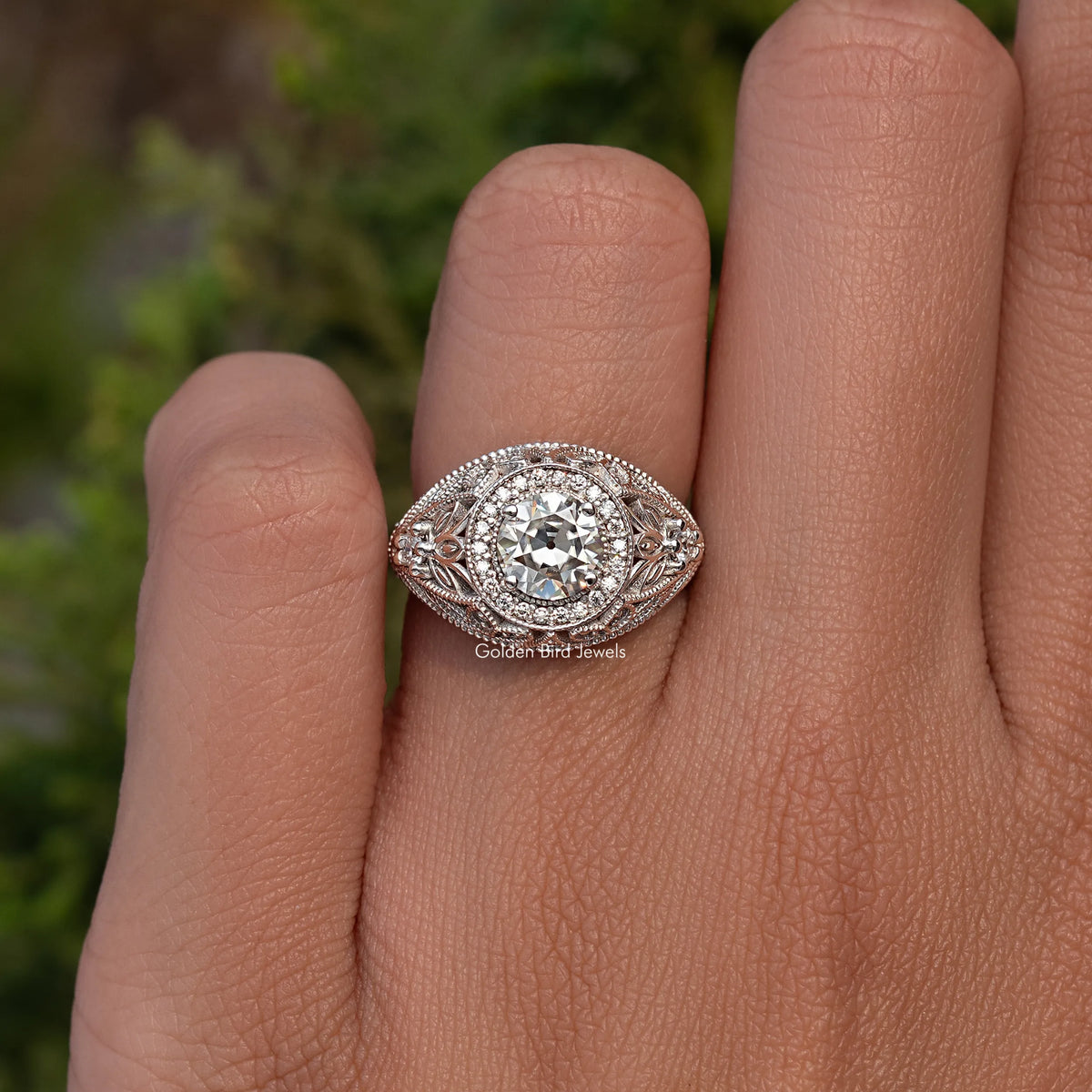 Vintage moissanite halo ring in sterling silver, round center stone close-up