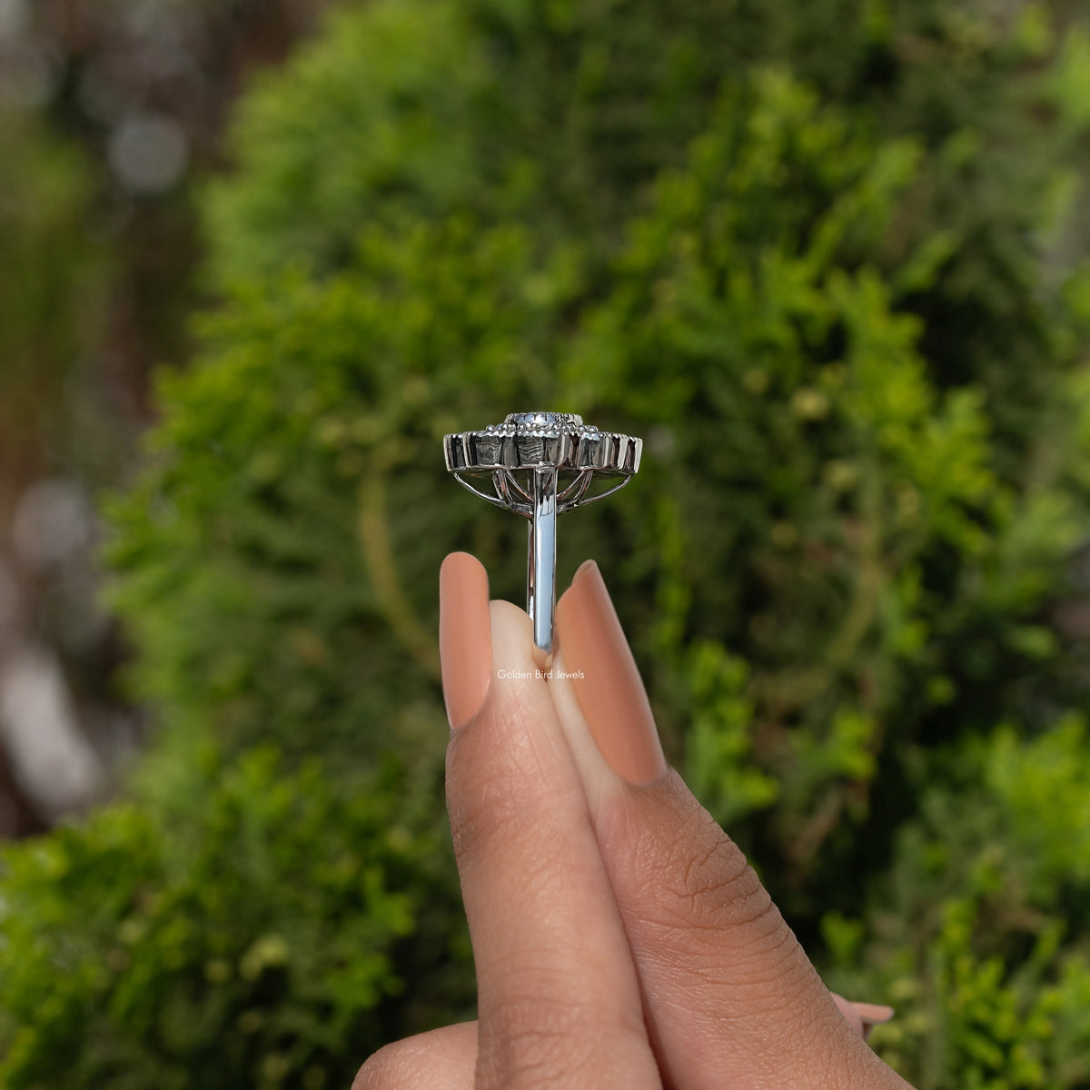 Sterling silver round halo moissanite ring, side view with raised center