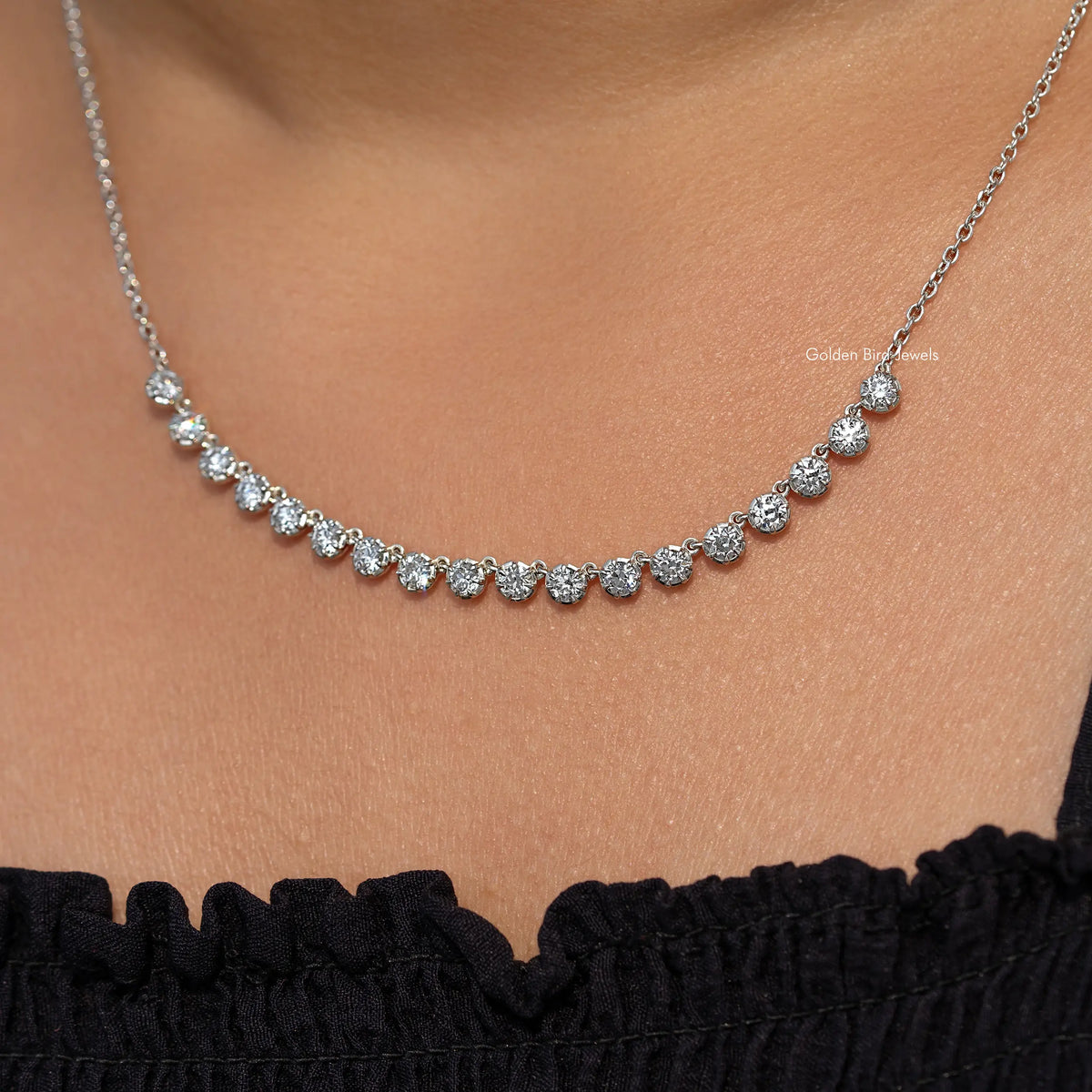 Silver-tone round-cut moissanite tennis necklace, evenly spaced stones close-up