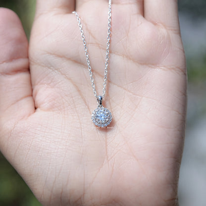 In Hand Showing of Old European Round Halo Lab Diamond Pendant