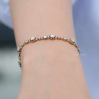 Round-stone tennis bracelet in silver, side view on wrist