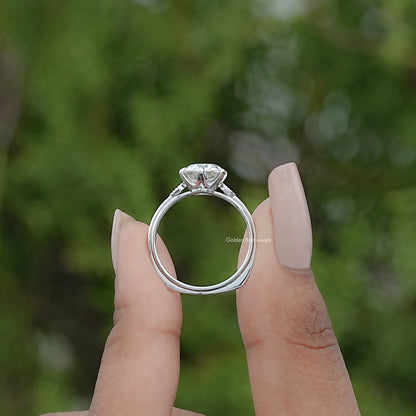 Back view of Round Cut Solitaire Engagement Ring in secure setting 
