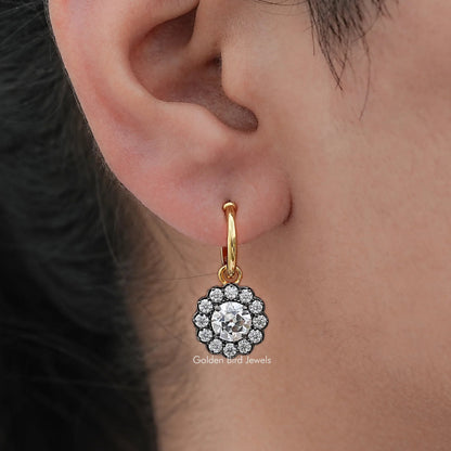 Gold hoop dangle earring with round halo clear-stone centerpiece and scalloped border