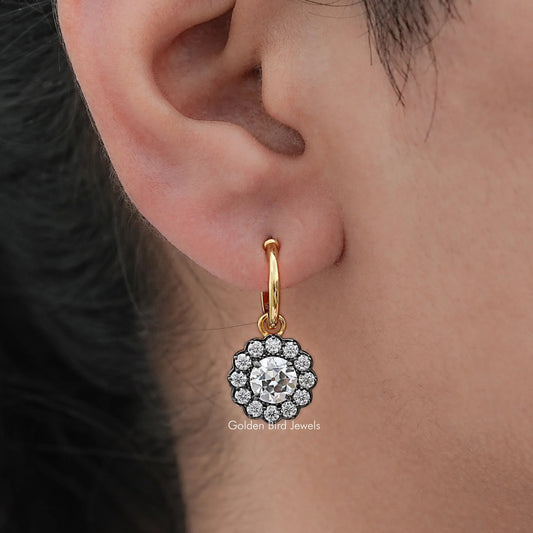 Gold hoop dangle earring with round halo clear-stone centerpiece and scalloped border
