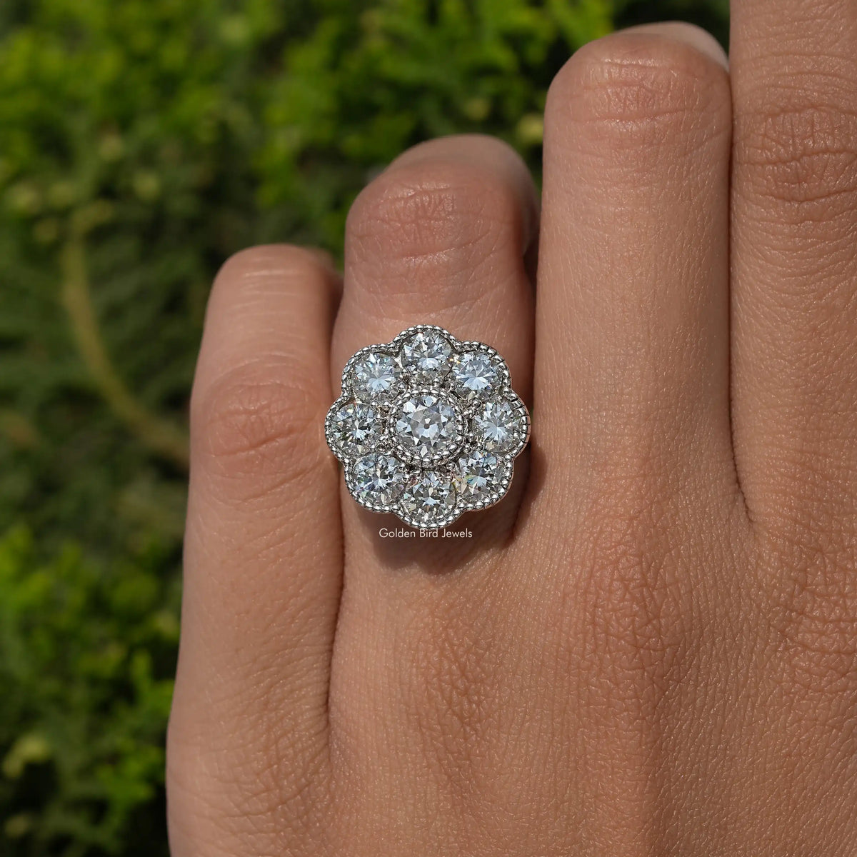 Sterling silver round halo moissanite ring, close-up on finger