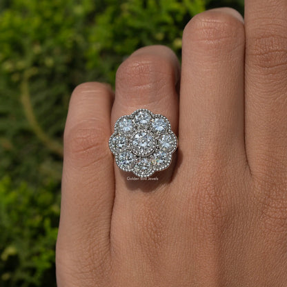 Sterling silver round halo moissanite ring, close-up on finger