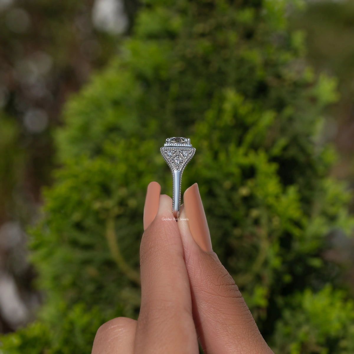 Sterling silver moissanite ring with art-deco style prong setting, side view