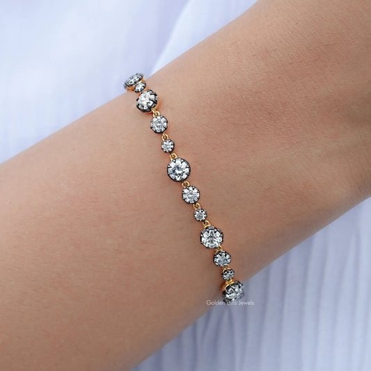 Round-stone bracelet with silver setting, close-up on wrist