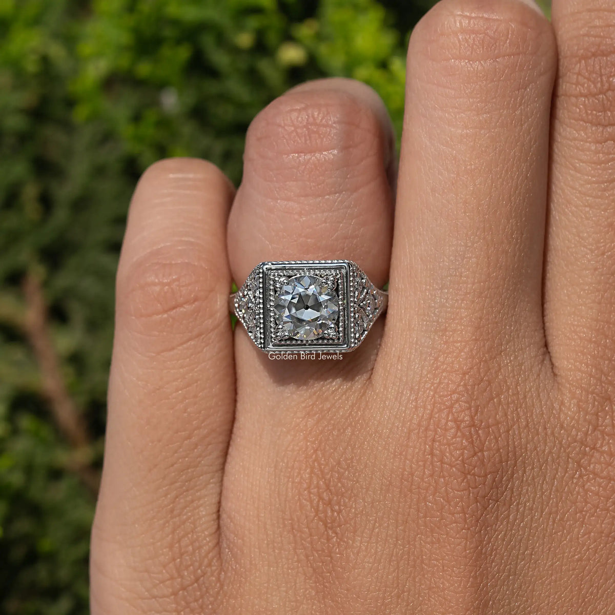 Sterling silver vintage moissanite ring with round center stone and halo