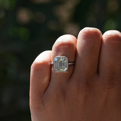 Asscher-cut moissanite bezel set ring on hand, square faceted center stone