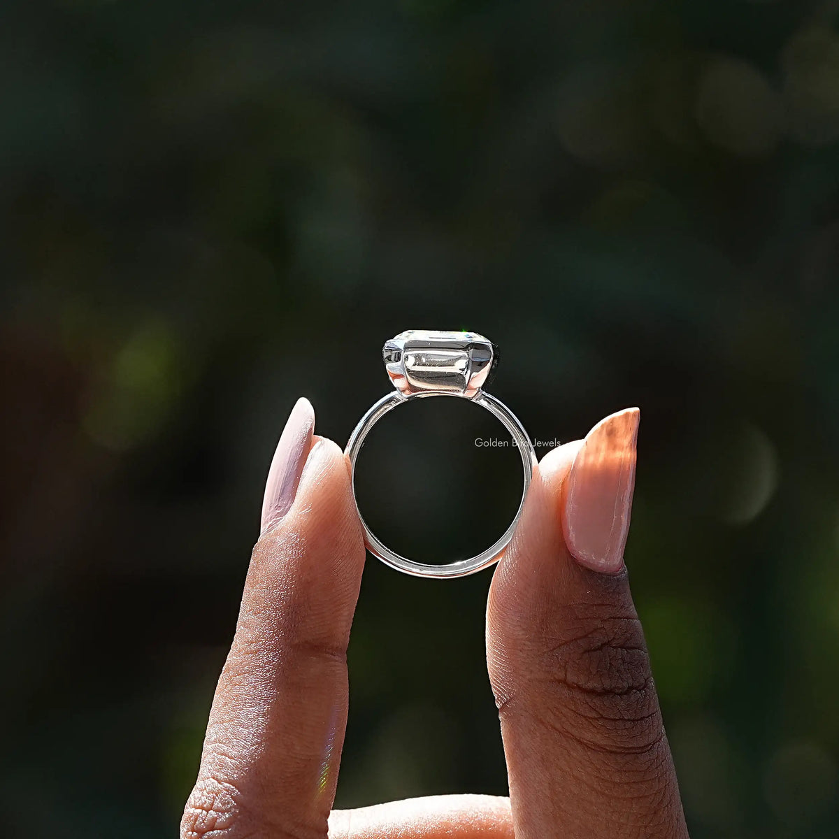 Asscher-cut moissanite bezel set ring, side view showing prong-set halo bezel