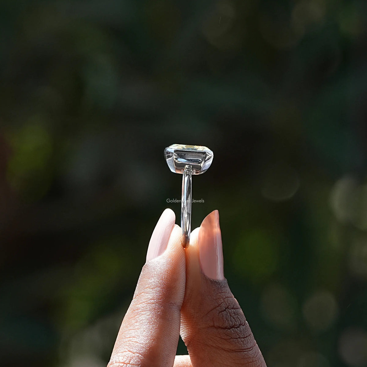 Asscher-cut moissanite bezel set ring, close-up of square stone and bezel setting