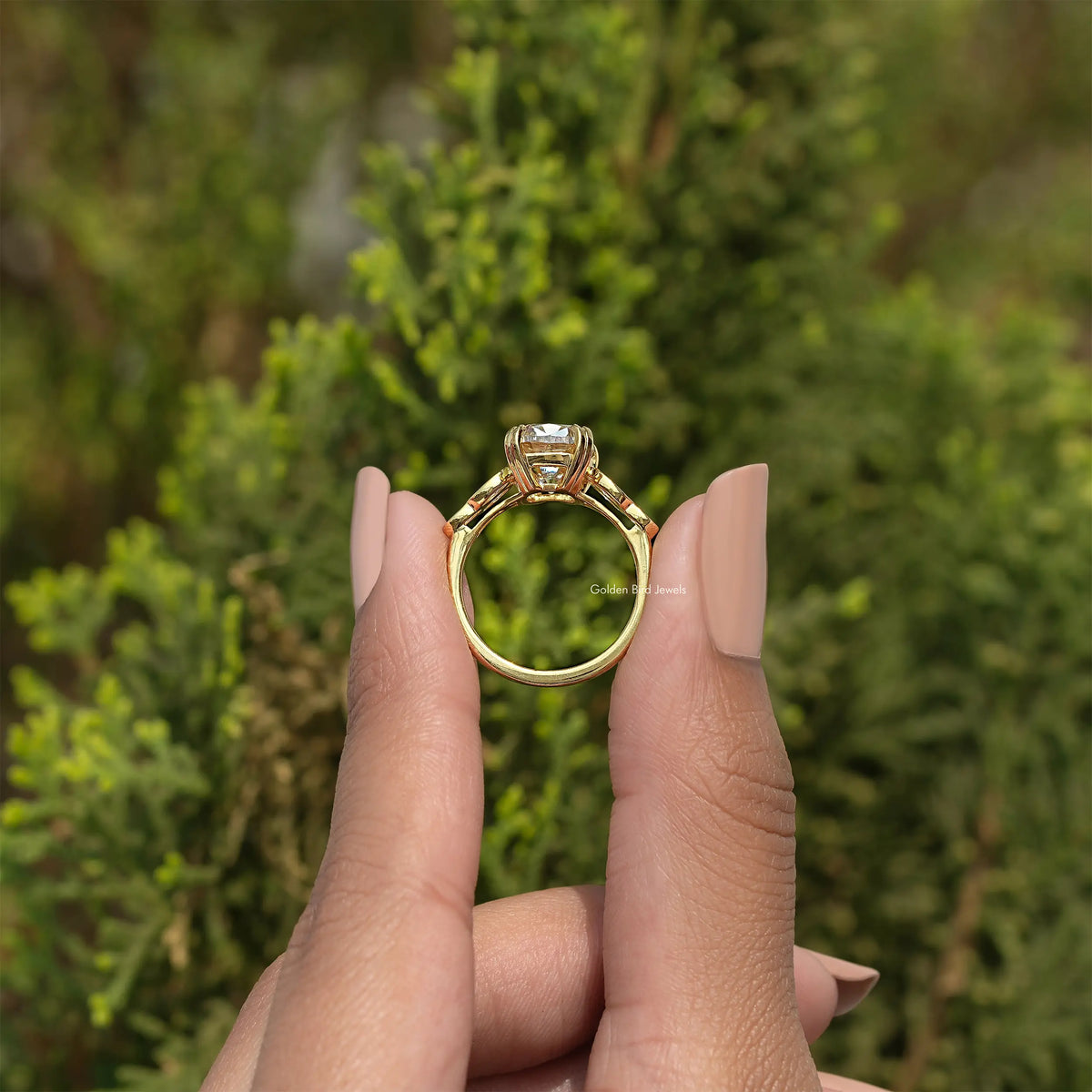 Gold-tone engagement ring, cushion-cut center stone with four round accent stones