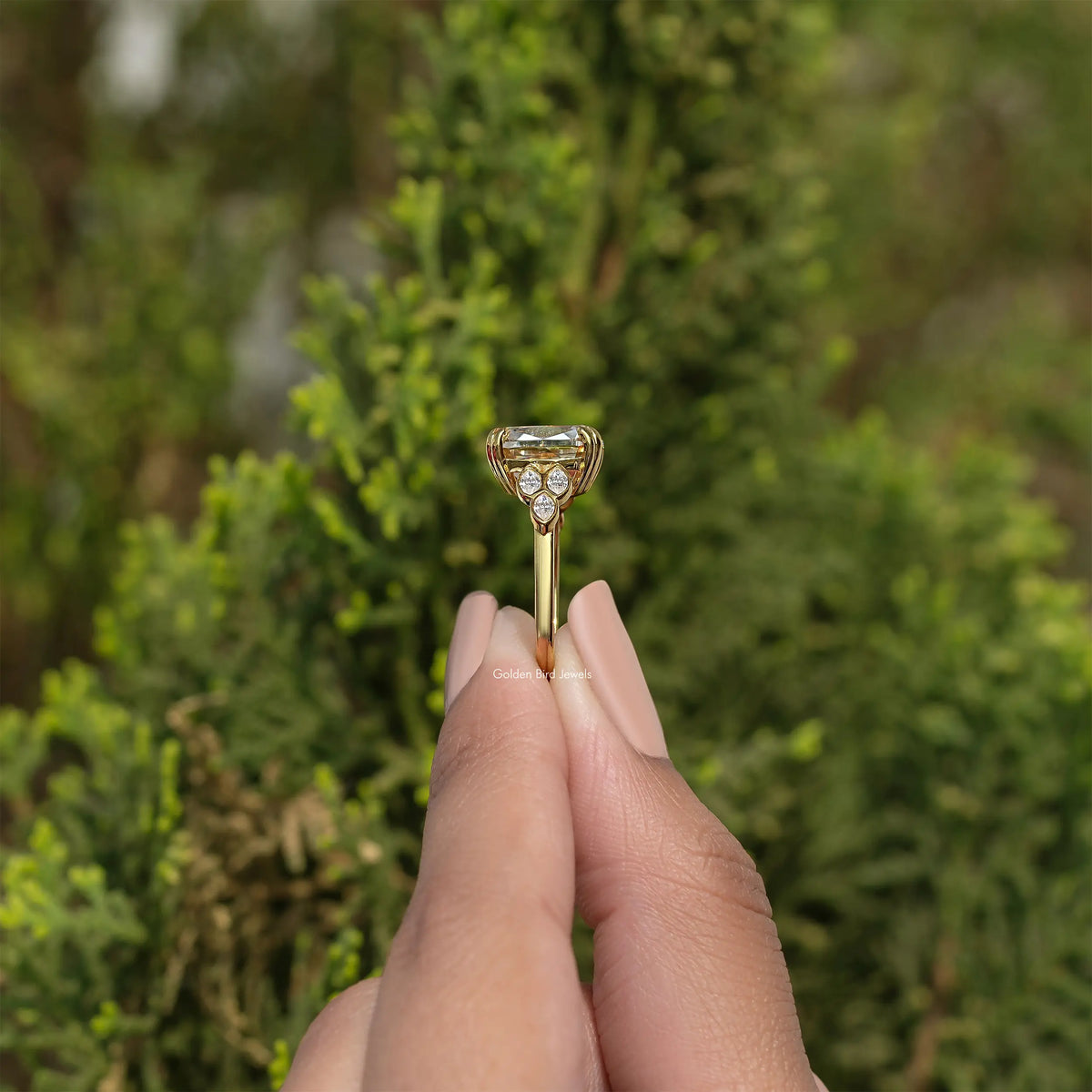 Gold-tone cushion-cut moissanite engagement ring with round side stones