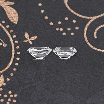 Two cushion-cut colorless moissanite stones, light sparkle, loose pair