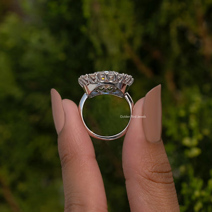Double halo cushion moissanite ring in sterling silver, on finger with open band view