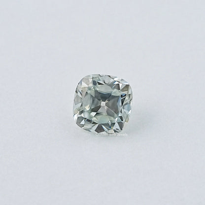 Cushion-cut moissanite gemstone, pale blue, centered face-up view