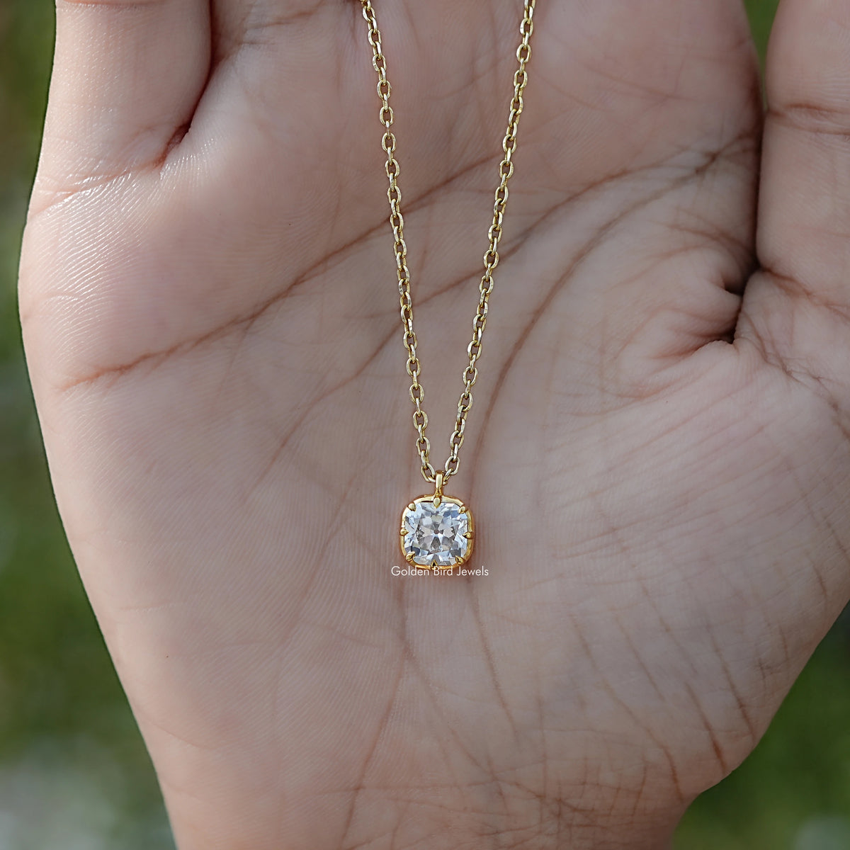 Close View Of Old Mine Cushion Moissanite Pendant in Secure Setting 