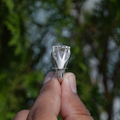 Underside view of silver tone cushion-cut solitaire moissanite ring