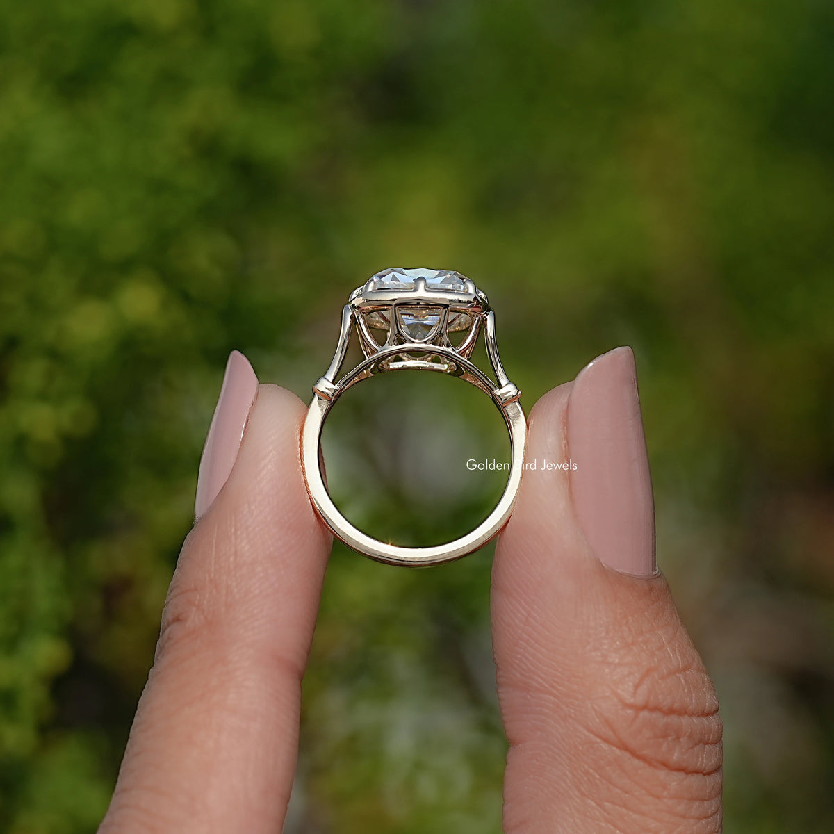 Gold cushion-cut moissanite solitaire ring, top view of prongs