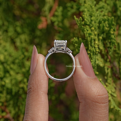 Back view of emerald-cut moissanite ring showing open gallery under center