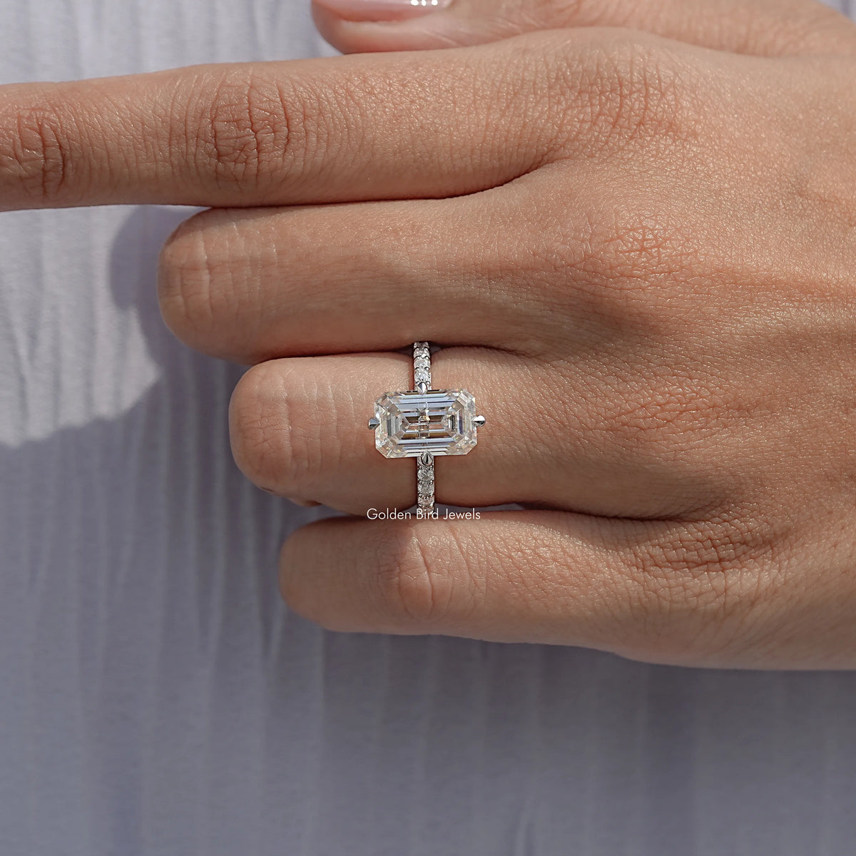 Close View Of Emerald Shaped Gemstone Seven Stone Band
