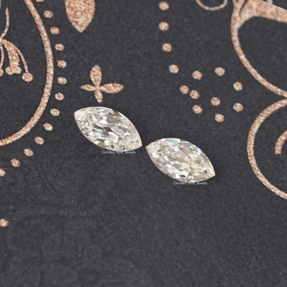 Two marquise-cut moissanite stones with faceted sparkle