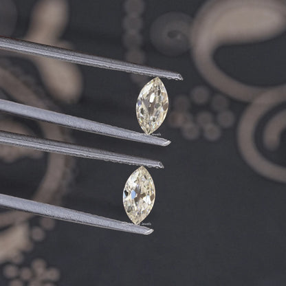 Stacked marquise-cut moissanite stones held in silver prongs