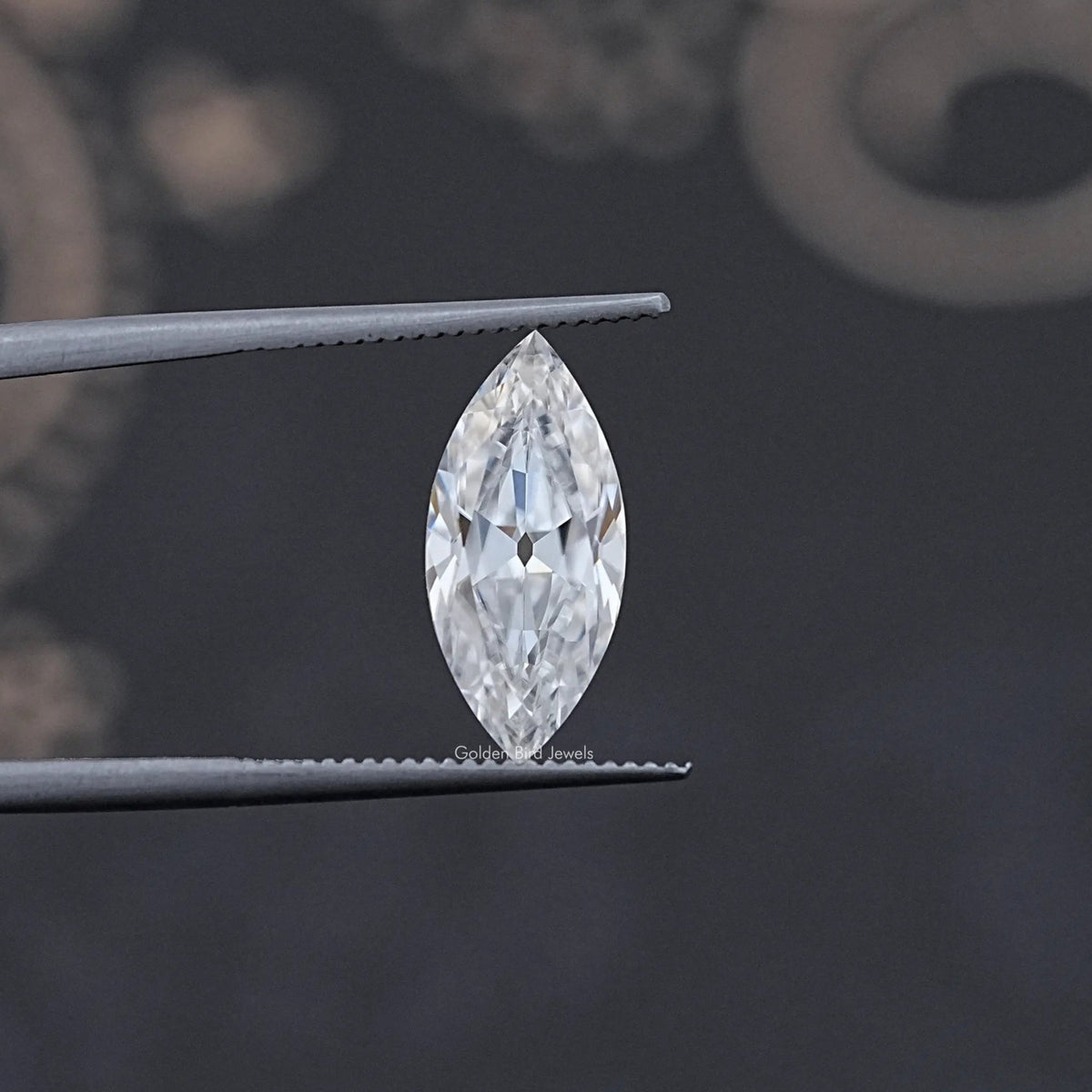 In Tweezer View Of Old Mine Marquise Cut Moissanite Loose Stone