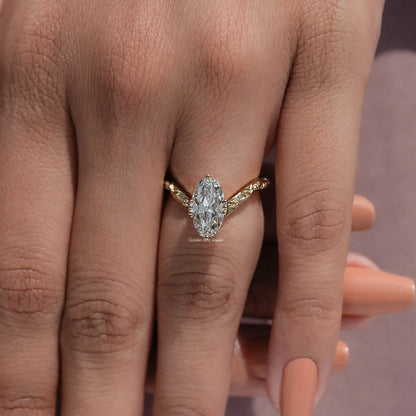 Curved diamond ring with large oval center stone on hand, close-up