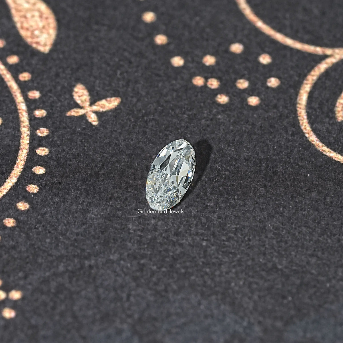 Oval faceted lab-grown diamond, side view, light icy