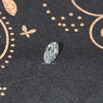 Oval faceted lab-grown diamond, side view, light icy