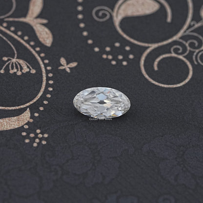 Oval moissanite loose stone, close-up with faceted sparkle and reflections
