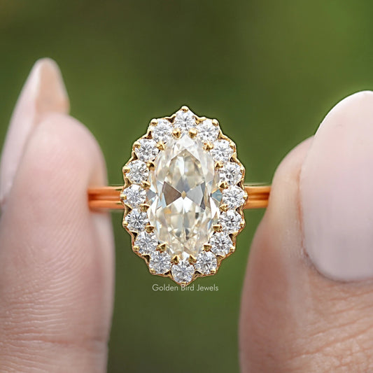 Gold-tone oval moissanite halo engagement ring, round halo stones