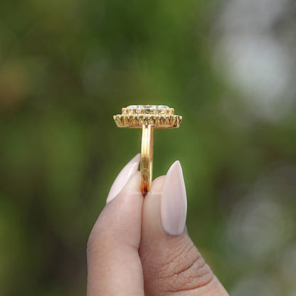 Gold-tone ring setting top view with prong-set halo stones