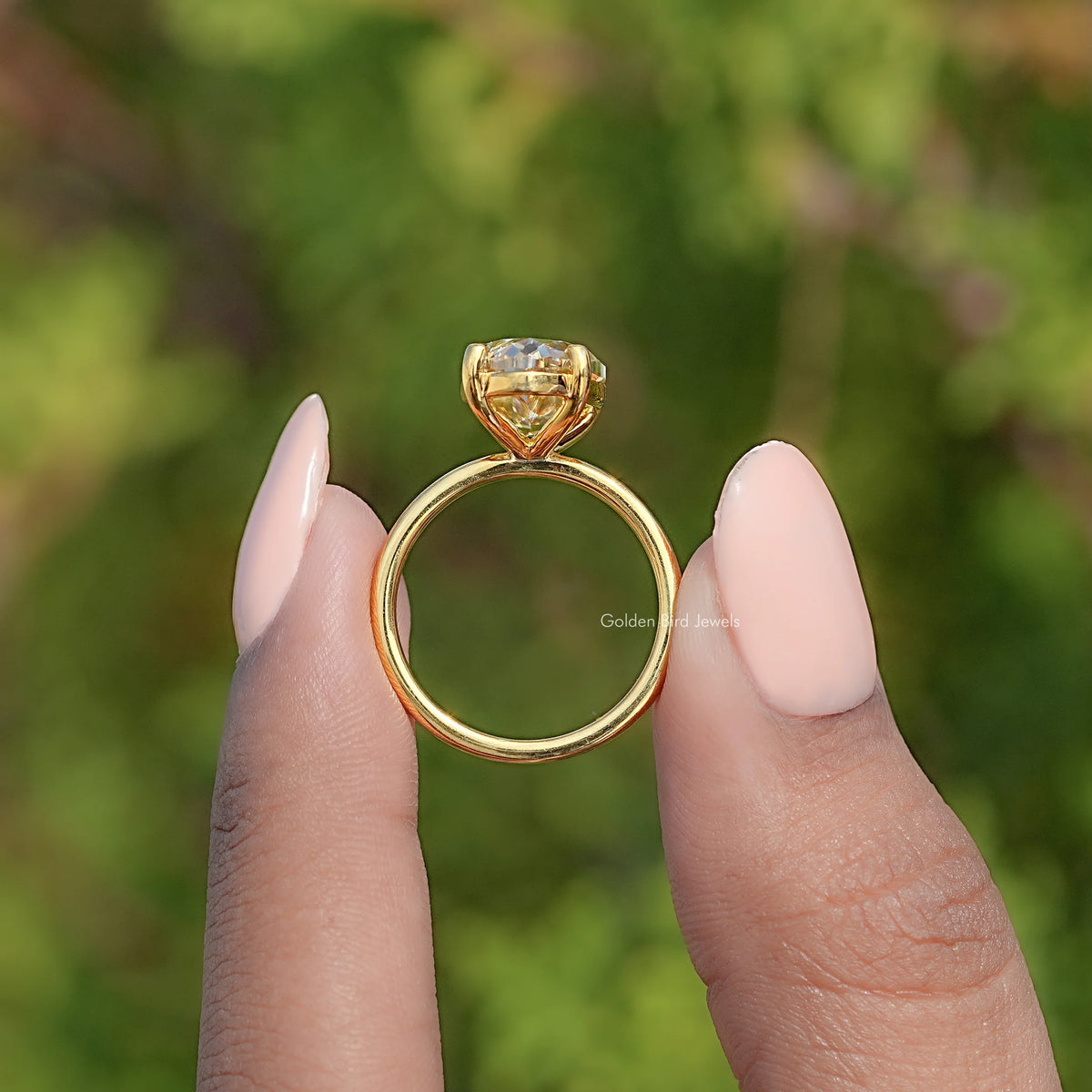 Gold-tone moissanite solitaire ring shank back view with open basket setting